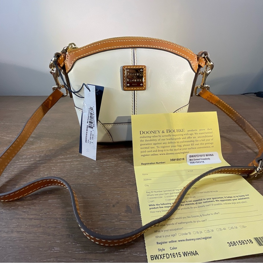 Dooney & Bourke Leather Crossbody in White/Cream color with Brown Trim